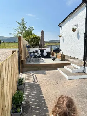 a woman standing in front of a house at Criffel View in Dumfries