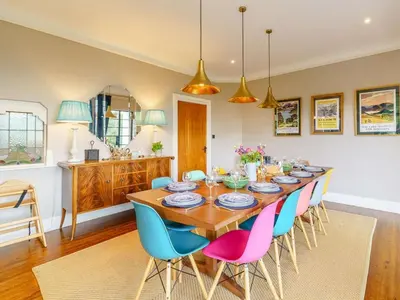 a dining room with a wooden table and chairs at 6 Bed in Keswick oc-89309 in Applethwaite