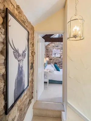 a hallway with a picture of a deer on the wall at 2 Bed in Uldale SZ060 in Uldale