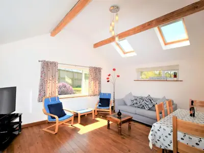 a living room with a couch and chairs at 2 Bed in Cockermouth SZ282 in Cockermouth