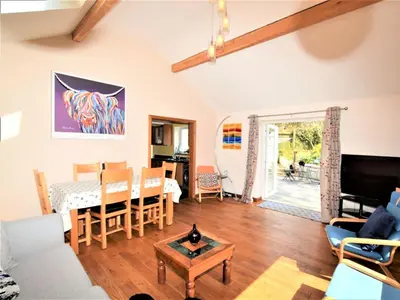 a living room with a couch and a table at 2 Bed in Cockermouth SZ282 in Cockermouth