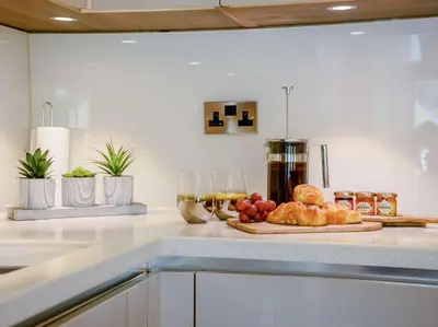 a kitchen counter with a plate of food on it at 2 Bed in Portinscale 89261 in Portinscale