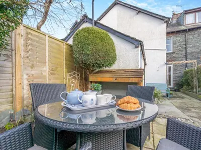 a table with a tray of croissants on a patio at 3 Bed in Keswick oc-89526 in Keswick