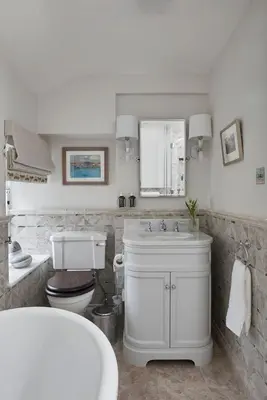a bathroom with a white sink and a toilet at The Little Cottage in Chapel Stile