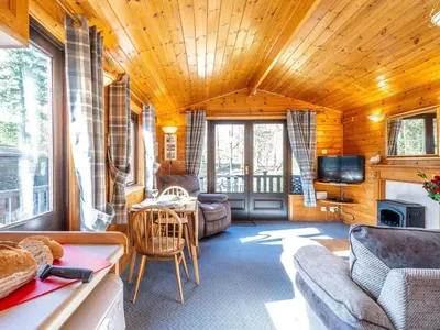 a living room with a couch and a table with a tv at 1 Bed in Keswick oc-82550 in Keswick