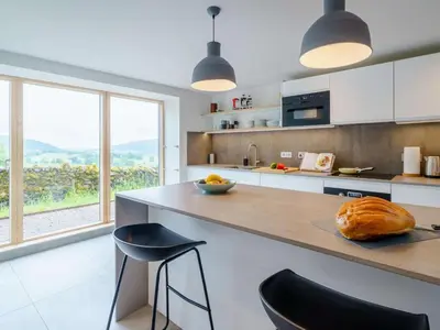 a kitchen with a counter with a loaf of bread on it at 3 Bed in Matterdale oc-83002 in Dockray