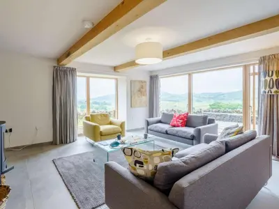a living room with a couch and a table at 3 Bed in Matterdale oc-83002 in Dockray