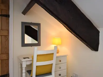 a room with a desk and a chair and a mirror at 3 Bed in Holmrook oc-sz313 in Boot
