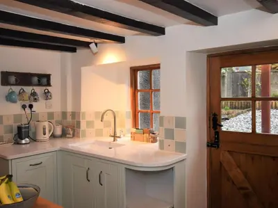 a kitchen with a sink and a window at 3 Bed in Holmrook oc-sz313 in Boot