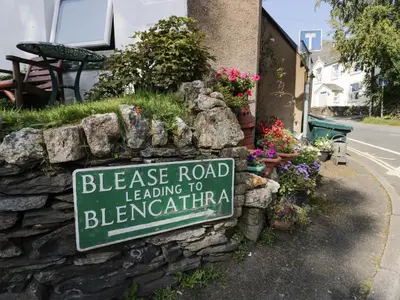 a sign for a driveway road leading to bernalore at Taylor's Cottage in Keswick