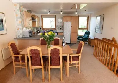 a kitchen and dining room with a table and chairs at Keswick Bridge 20, within walking distance of Keswick town centre, strictly no pets in Keswick