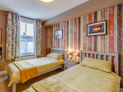 a bedroom with two beds and a window at 3 Bed in Keswick 86162 in Keswick