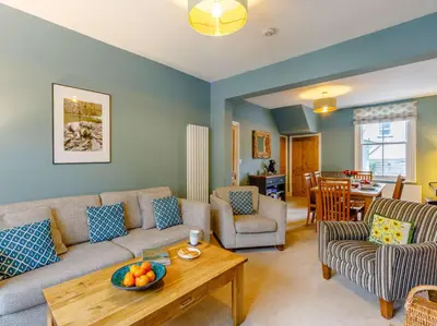 a living room with a couch and a table at 3 Bed in Keswick 86162 in Keswick