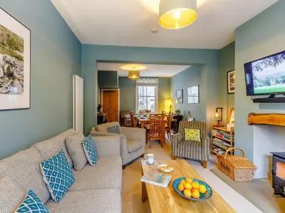 a living room with a couch and a tv at 3 Bed in Keswick 86162 in Keswick