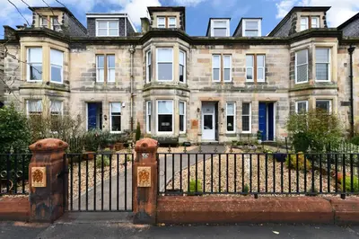 an old house with a iron fence in front of it at The Townhouse Ayr - Luxury B&B - adults only in Ayr