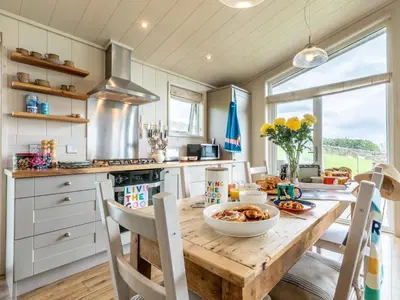 a kitchen with a wooden table with a bowl of food on it at 2 Bed in Caldbeck 80563 in Caldbeck
