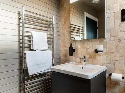 a bathroom with a sink and a mirror at 3 Bed in Portpatrick 77308 in Portpatrick