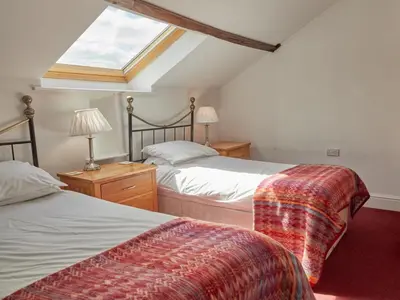 a attic bedroom with two beds and a skylight at 8 Bed in Applethwaite SZ373 in Applethwaite