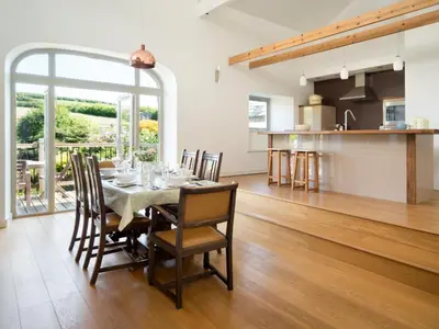 a dining room and kitchen with a table and chairs at 3 Bed in Egremont oc-sz230 in Hale
