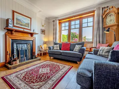a living room with two couches and a fireplace at 3 Bed in Holmrook oc-sz414 in Santon Bridge