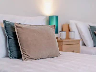 a pillow sitting on top of a bed at 2 Bed in Keswick oc-sz140 in Keswick