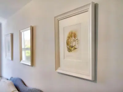 a picture on a white wall with three mirrors at 6 Bed in Keswick oc-sz389 in Keswick