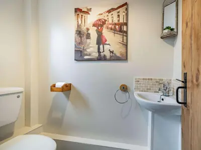 a bathroom with a sink and a painting on the wall at 2 Bed in Wasdale oc-tcsz436 in Santon Bridge