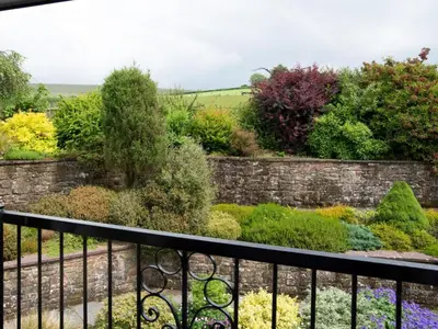 a view of a garden from a balcony at 3 Bed in Egremont oc-sz058 in Hale