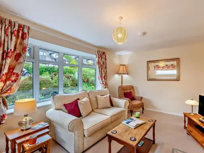 a living room with a couch and a table at 2 Bed in Keswick oc-sz008 in Keswick