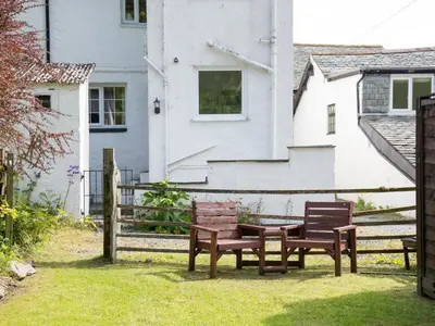 a group of benches in front of a house at 2 Bed in Keswick oc-sz068 in Rosthwaite