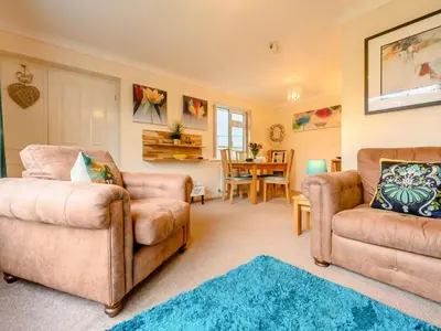 a living room with two chairs and a couch at 1 Bed in Keswick SZ133 in Keswick