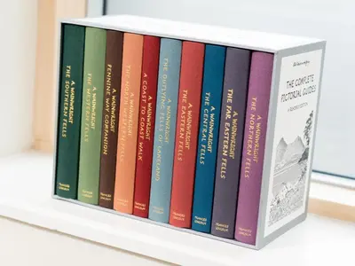 a stack of books sitting on a shelf at 4 Bed in Keswick SZ267 in Keswick