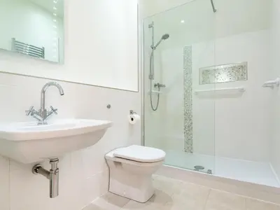 a bathroom with a sink and a toilet and a shower at 3 Bed in Applethwaite SZ168 in Applethwaite