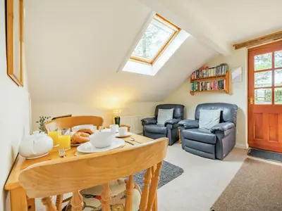 a living room with a table and a couch at 1 Bed in Penrith oc-sz295 in Dockray
