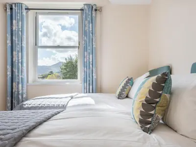 a bedroom with a bed with a window at 2 Bed in Keswick oc-sz490 in Keswick