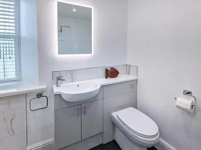 a white bathroom with a sink and a toilet at 2 Bed in Keswick oc-sz490 in Keswick