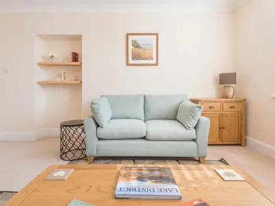 a living room with a couch and a table at 2 Bed in Keswick oc-sz490 in Keswick
