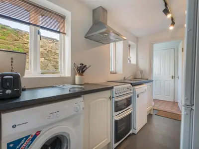 a kitchen with a washing machine and a sink at 3 Bed in Keswick SZ187 in Keswick