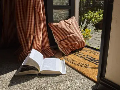 an open book sitting on the floor next to a door at 2 Bed in Cockermouth oc-sz136 in Lorton