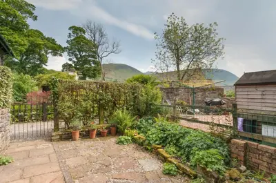 a garden with plants and a fence at 2 Bed in Cockermouth oc-sz136 in Lorton