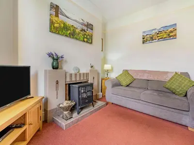 a living room with a couch and a flat screen tv at 3 Bed in Keswick SZ395 in Keswick