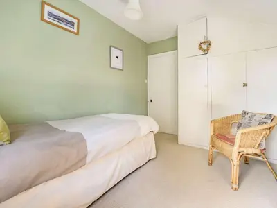 a bedroom with a bed and a chair in it at 3 Bed in Keswick SZ395 in Keswick