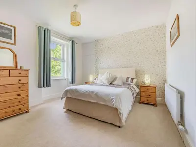 a bedroom with a bed and a dresser and a window at 3 Bed in Keswick SZ395 in Keswick