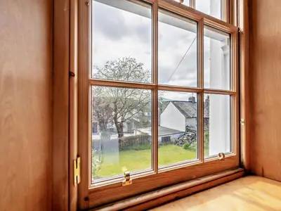 an empty room with a window looking out at a yard at 1 Bed in Keswick SZ472 in Keswick