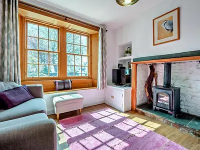 a living room with a fireplace and a couch at 1 Bed in Keswick SZ472 in Keswick