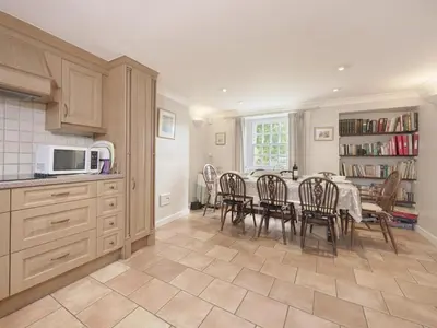 a kitchen and dining room with a table and chairs at 4 Bed in Keswick oc-sz434 in Applethwaite