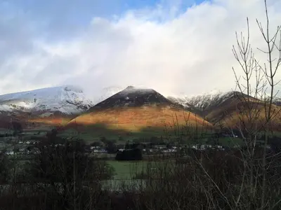 a mountain range with snow capped mountains in the background at 3 Bed in Keswick oc-sz135 in Threlkeld