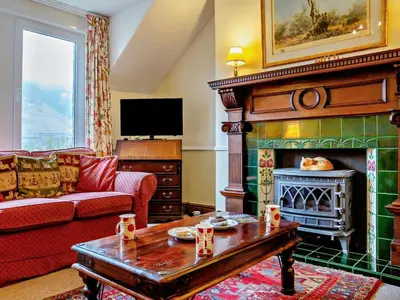 a living room with a couch and a fireplace at 3 Bed in Keswick oc-sz135 in Threlkeld