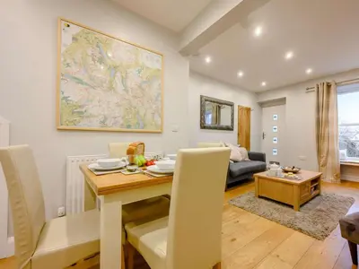 a living room with a table and a couch at 2 Bed in Keswick oc-sz036 in Keswick