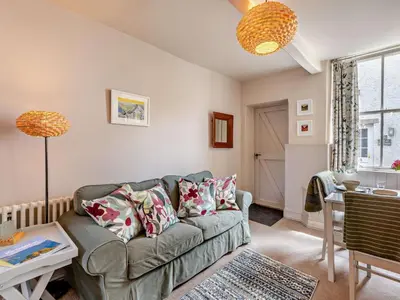 a living room with a couch and a table at 1 Bed in Keswick oc-sz112 in Keswick